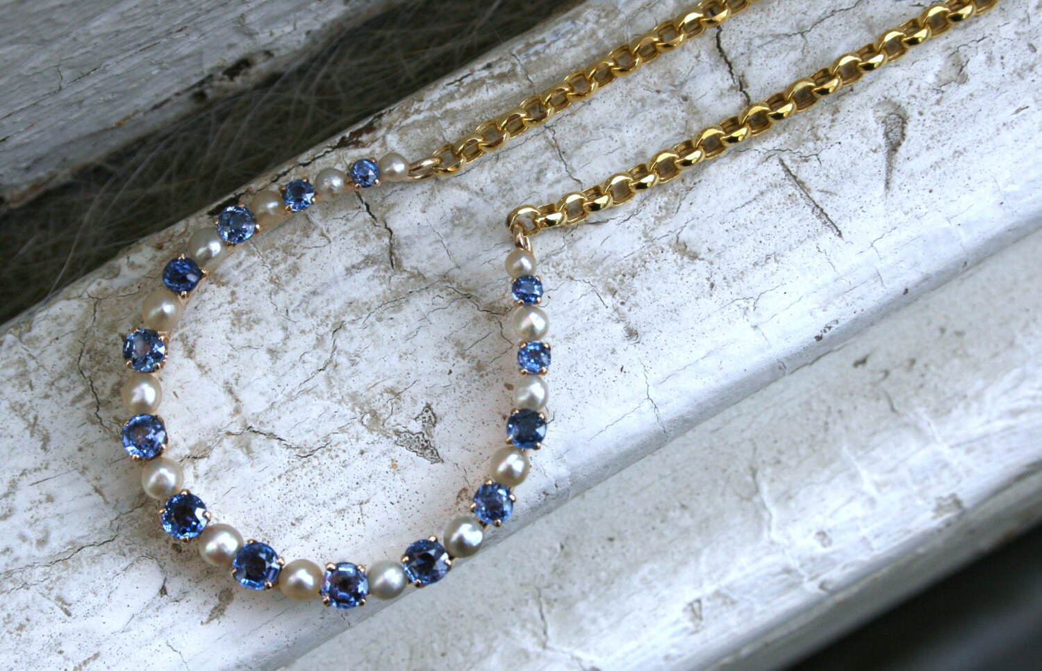 Vintage 14K Yellow Gold Pearl and Sapphire Horseshoe Necklace.