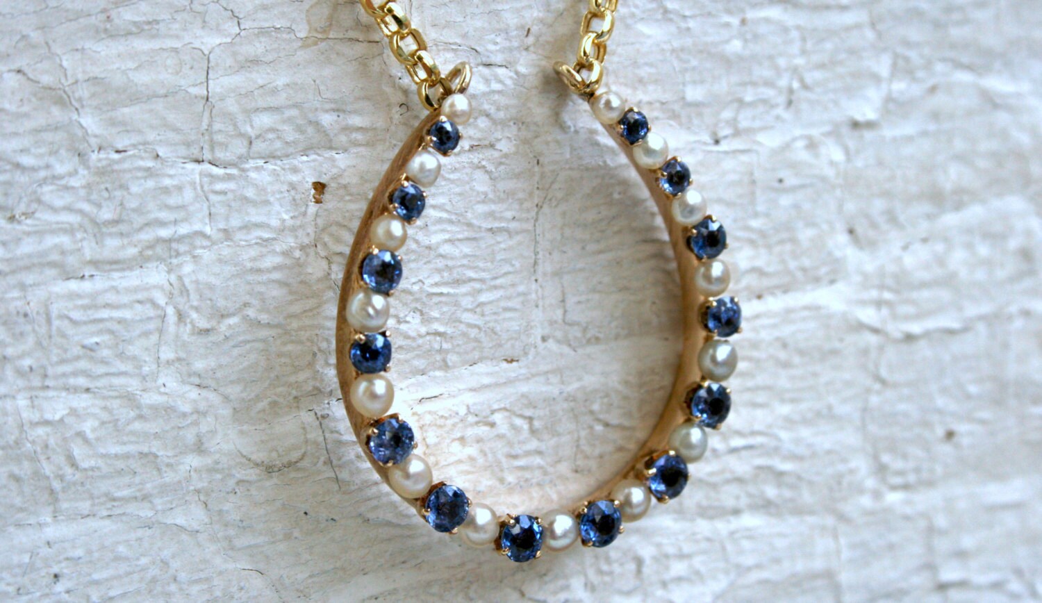 Vintage 14K Yellow Gold Pearl and Sapphire Horseshoe Necklace.