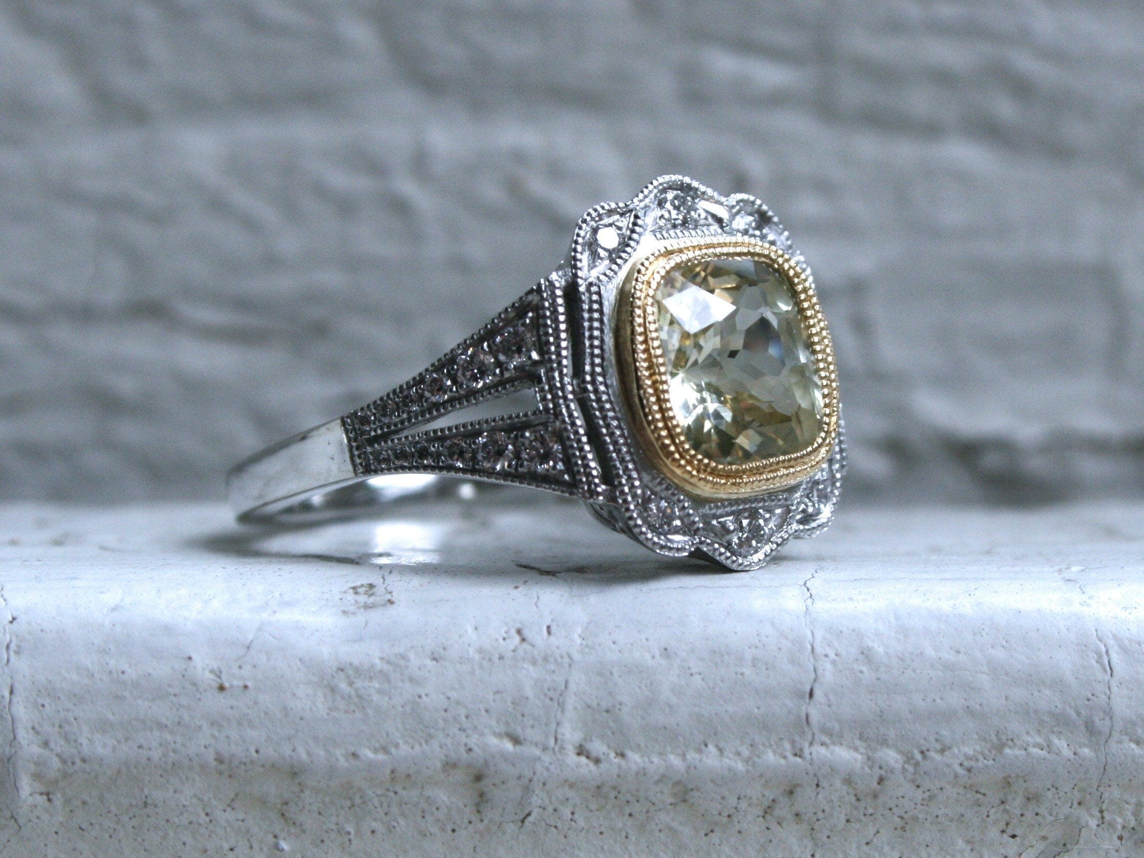 Natural Yellow Sapphire and Diamond Halo Engagement Ring in Platinum.