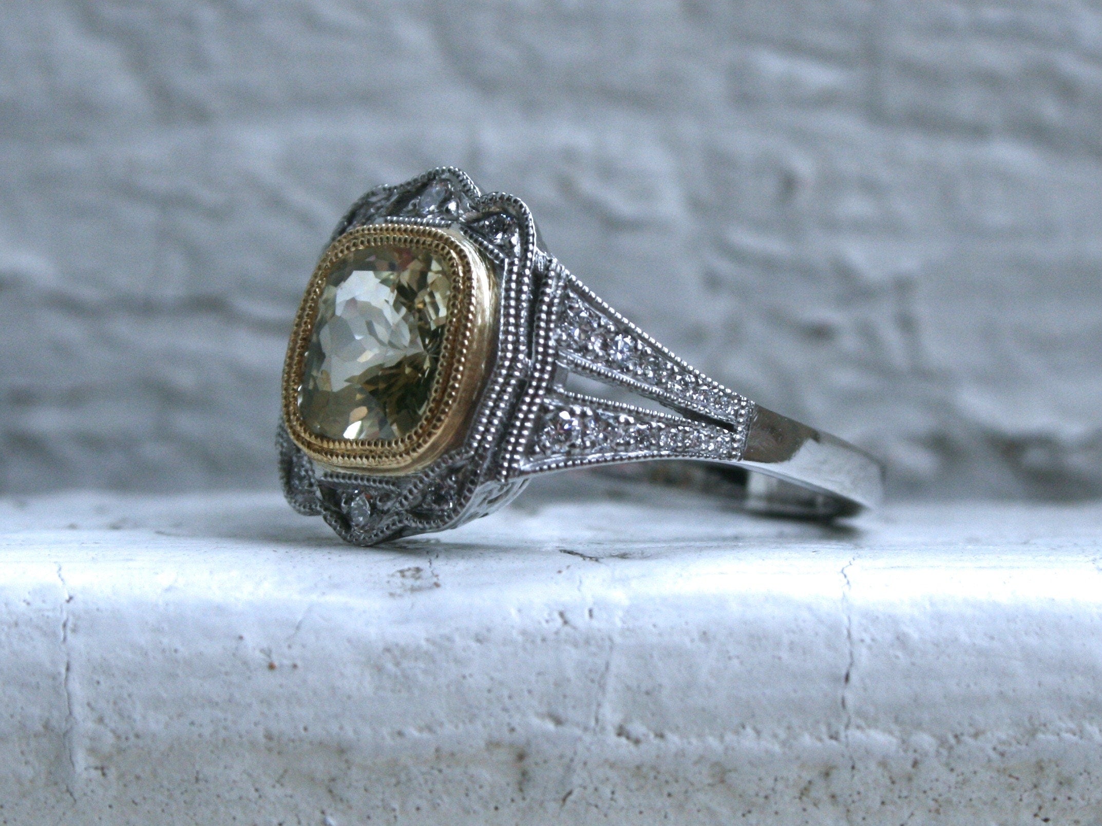 Natural Yellow Sapphire and Diamond Halo Engagement Ring in Platinum.