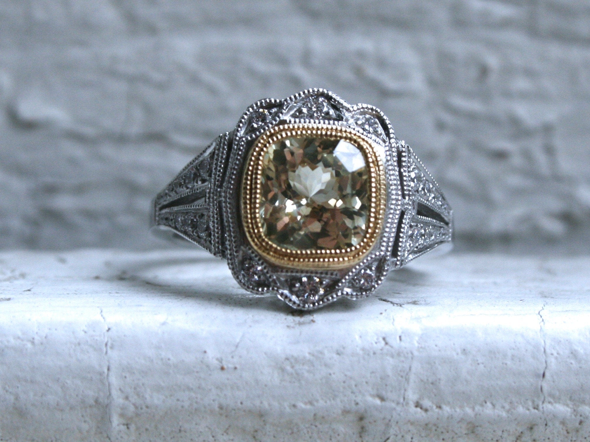 Natural Yellow Sapphire and Diamond Halo Engagement Ring in Platinum.