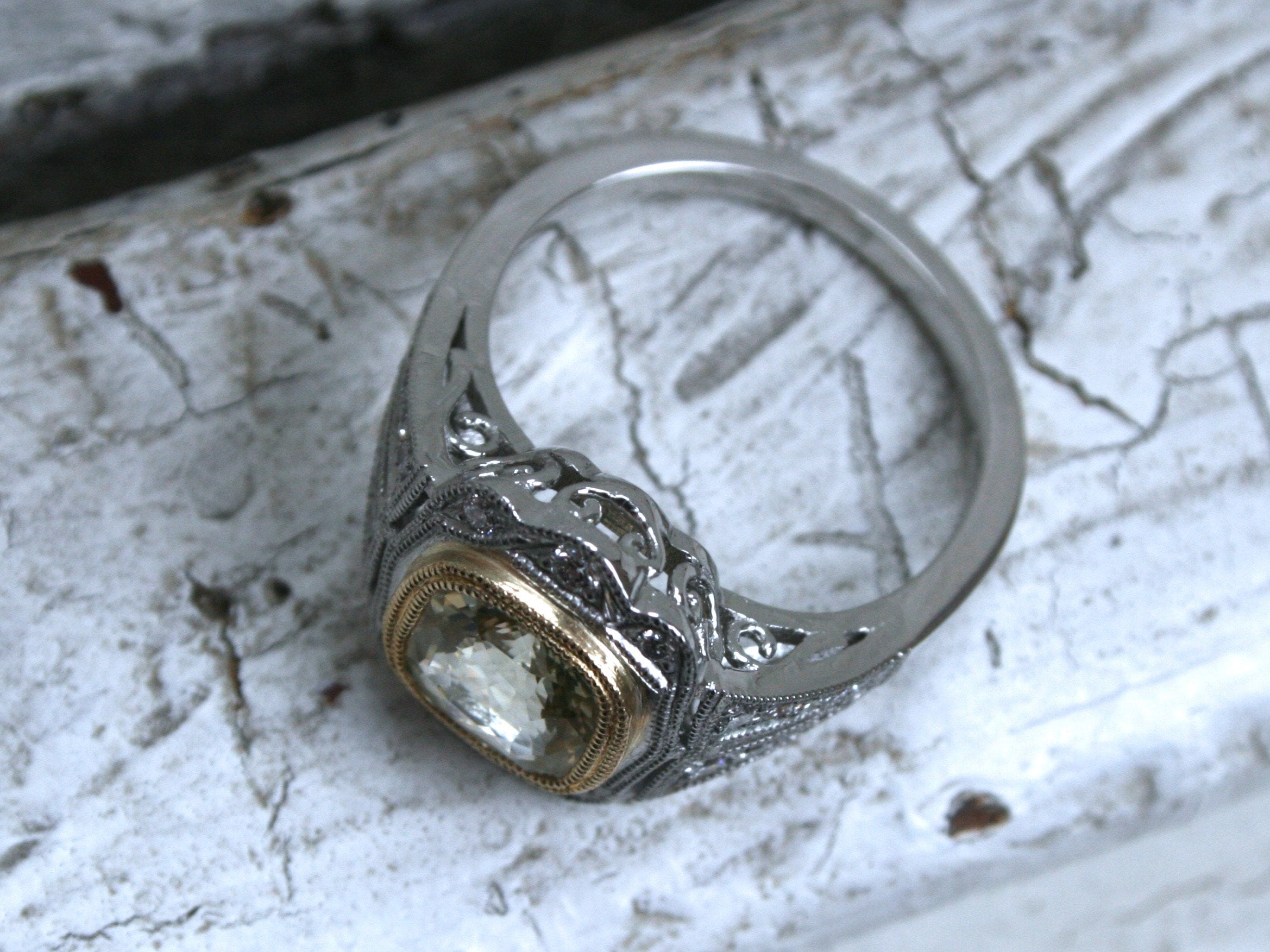 Natural Yellow Sapphire and Diamond Halo Engagement Ring in Platinum.