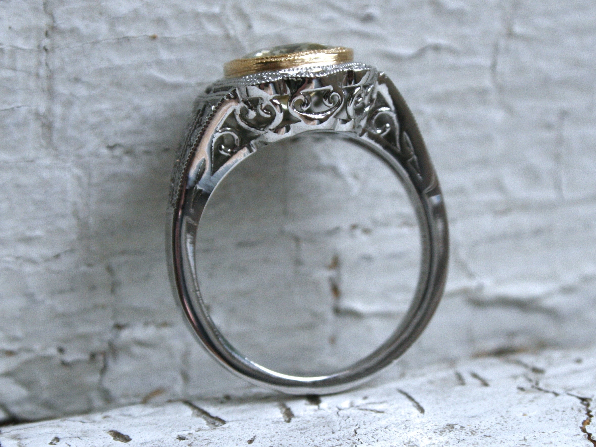 Natural Yellow Sapphire and Diamond Halo Engagement Ring in Platinum.