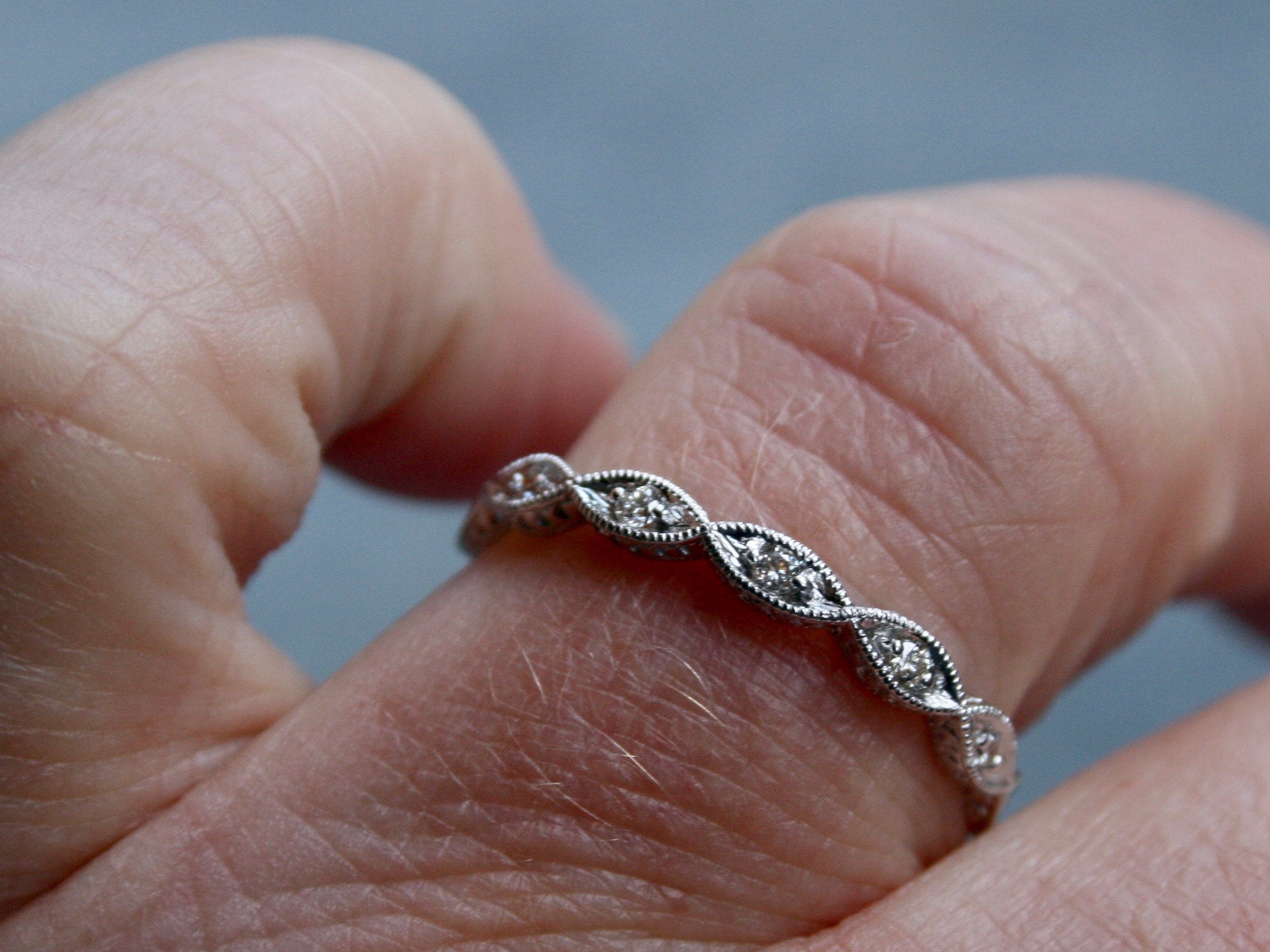 Twisted 14K White Gold Diamond Wedding Band with Engraved Sides.