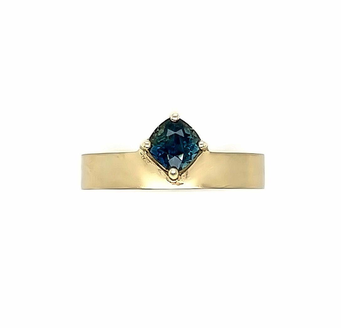 One of a Kind Off Set Cushion Sapphire Solitaire Ring.