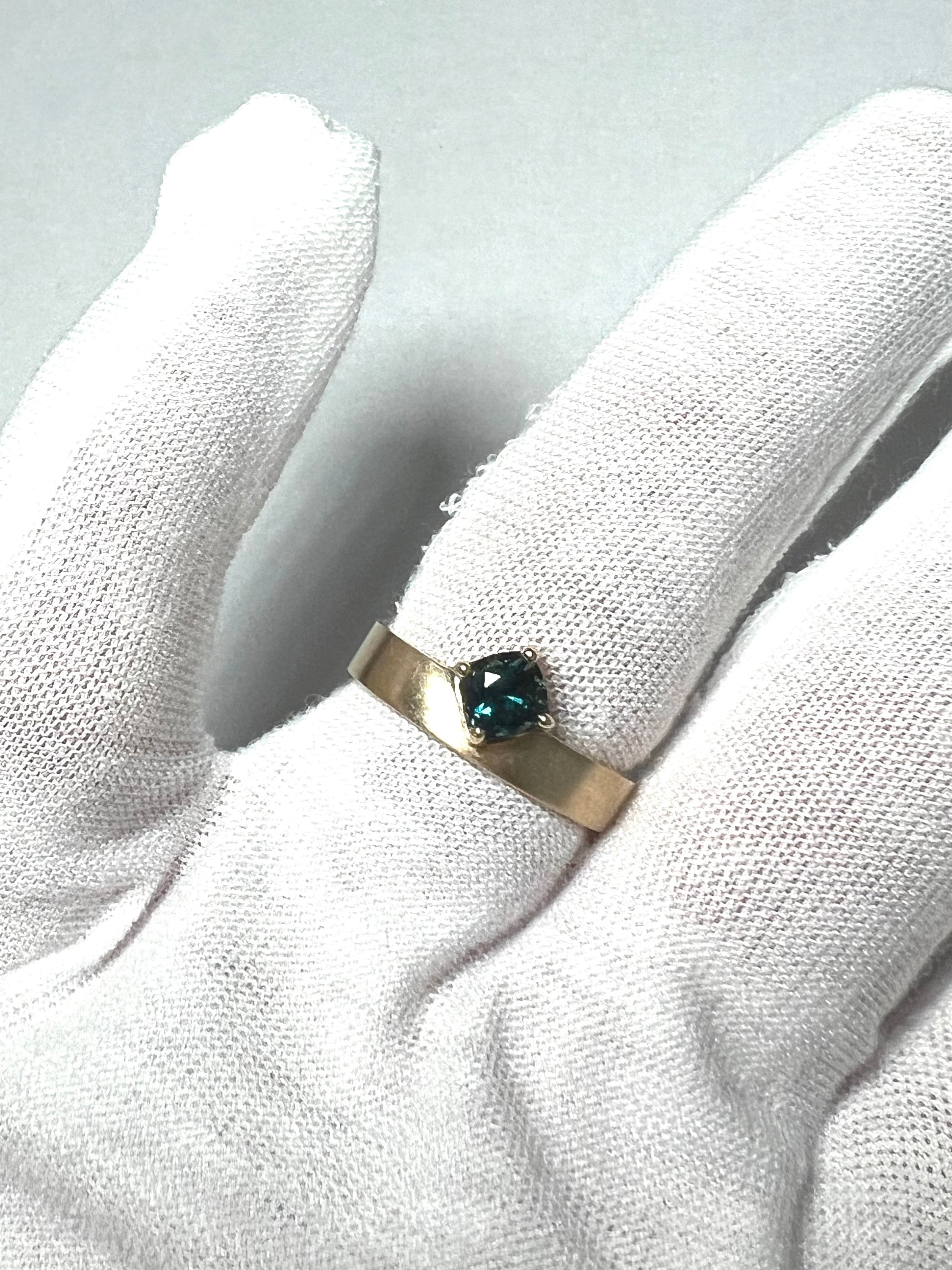 One of a Kind Off Set Cushion Sapphire Solitaire Ring.